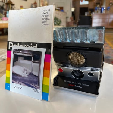 Vintage Polaroid SX-70 SONAR OneStep Land CameraEach piece of glass, metal, and leather collapses into a self-contained case for compact carrying. Camera is in working condition. 