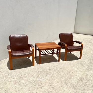 Pair of 1980\u2019s Danish teak and leather arm chairs