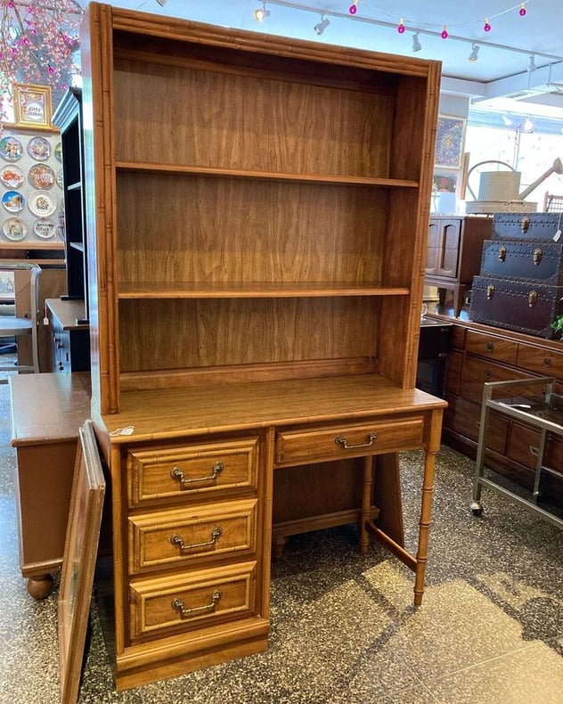 Faux bamboo two piece desk with shelf. Laminate top on the desk. 42” x 18” x 72” 