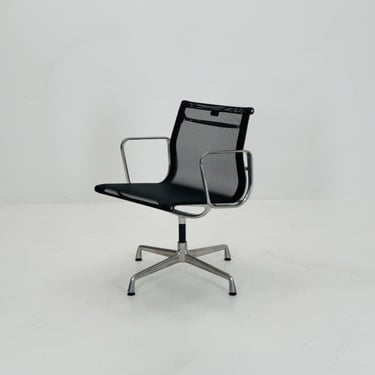 Mid century Eames EA 108 office chair by Vitra with black mesh and polished aluminum 1960s 