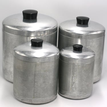 vintage aluminum canisters with black handles set of four 
