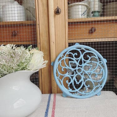 Beautiful vintage  French cast iron trivet in beautiful blue 