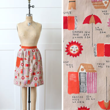 vintage 1950s novelty print apron • french holiday beach & sun print cotton apron with pocket 