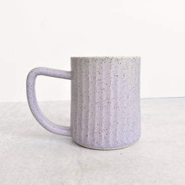 Fluted Ceramic Mug in speckled clay in light purple lavender 