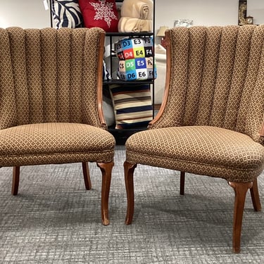 A Pair Of Vintage Wingback Chairs
