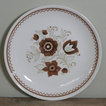 vintage round platter with brown and tan floral motif 