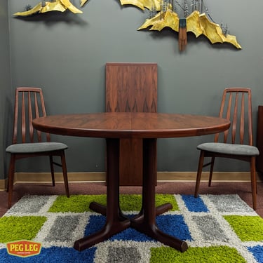 Danish Modern rosewood dining table with drop-in extension (Pictured set of chairs sold separately)