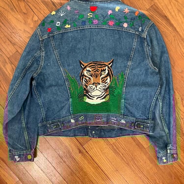 70s Lee denim jacket with hand-embroidered florals and tiger head 