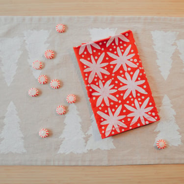mod winter motif on red. block printed linen napkins / placemats / tea towels. set of four. boho christmas party. holiday decor. winter. 