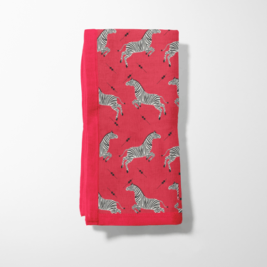 Leaping Zebras Napkin in Poppy in Lightweight Linen