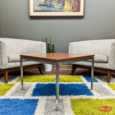 Mid-Century Modern living room table with walnut top and chrome base by Florence Knoll