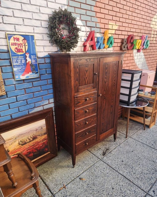 Early 20th Century Chifferobe. Mission highlights/Art and Crafts tone. Bar to hang clothing, Hat Box, 5 drawers. Looks like Chestnut w very active grain pattern. On casters. 