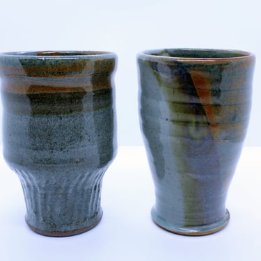 Ceramic tumblers- Handmade Stoneware with a speckled blue glaze and shino glaze, and one with Wu's Blue and Celadon Glaze 