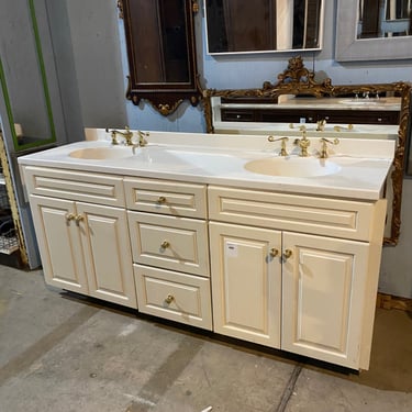 Cream-Colored Double Bathroom Vanity with Polished Brass Hardware