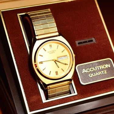 Vintage 1988 Bulova Accutron Gold Tone Swiss Quartz Day/Date Wristwatch W/ Original Box & Papers, Speidel Two-Tone Stretch Band, 7