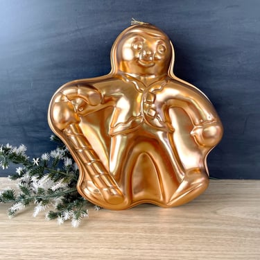 Gingerbread man with candy cane copper colored mold 
