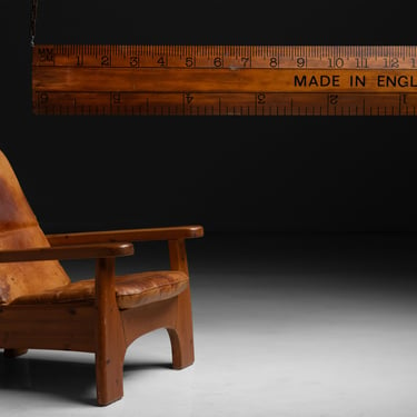 Reclining Leather Chair / Oversized Ruler