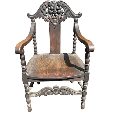 Beautiful antique solid oak carved face chair 