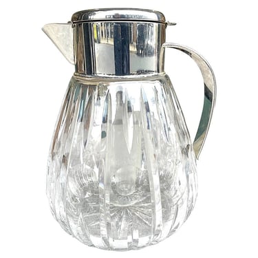 A 1960s German crystal and silver plated lemonade jug with central ice tube