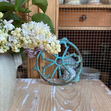 Beautiful vintage French cast iron trivet in blue 