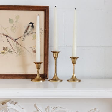 trio of graduated vintage french brass candlesticks
