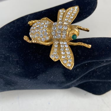 Vintage bling golden metal bug brooch pin rhinestones and green eyes 2” 