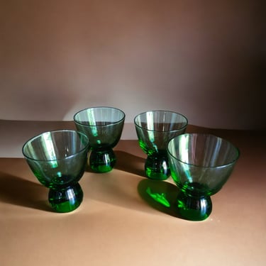 Iconic MCM green glassware collection featuring heavy bottomed cordial glasses Classic retro green cordial shot glasses with weighty bottoms 