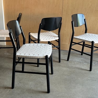 Set of four lacquered woven dining chairs