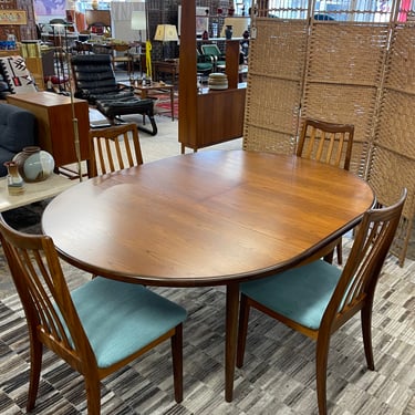 Mid Century Teak Round to Oval Butterfly Leaf Dining Table with Four Teak Slatted Highback Dining Chairs by GPlan