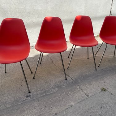 Set of 4 contemporary Eames office chairs | bright orange scoop chairs | Herman Miller seating | 2018 made in the USA 