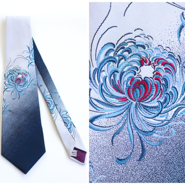 Light gray necktie with blue and red embroidered flower motif 