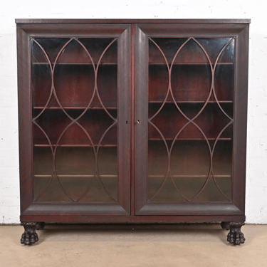 George C. Flint Co. Antique American Empire Carved Mahogany Double Bookcase With Lion’s Paw Feet, Circa 1890s