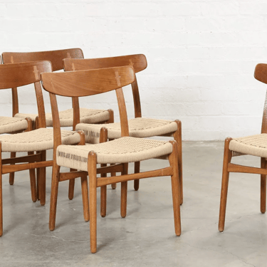 A set of six Hans Wegner teak CH23 chairs in danish cord by Carl Hansen