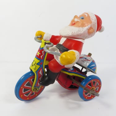 Vintage Santa Claus on Bike Wind Up Toy 