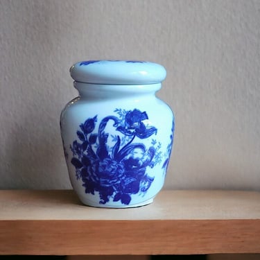 VINTAGE Chinese porcelain jar blue and white Oriental-style lid and lotus motif Intricately designed  porcelain lidded jar with lotus theme 