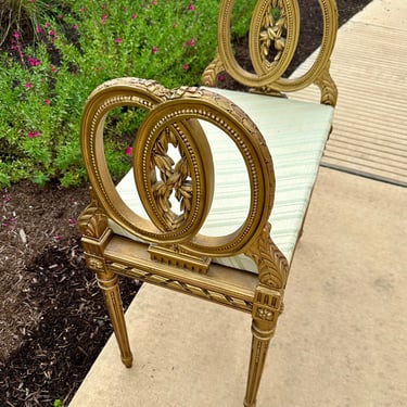 Antique Louis XVI Style Gilded Wooden Bench with Cane Seat and Cushion, Carved Leaf and Pink Ribbon Details 