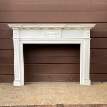 Traditional Fireplace Mantel with Urn Accent Design
