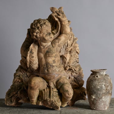 Mid to Late 18th Century Terra Cotta Fountainhead of a Putto Riding a Dolphin