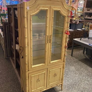 Faux bamboo china hutch with silverware drawer and a light situation  34.5” x 16.5” x 79.5”