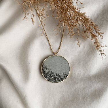 Concrete necklace | concrete jewelry | light gray concrete | crushed pyrite | statement necklace | brass pendant | stainless steel 
