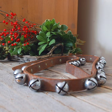 Vintage sleigh bells / antique jingle bells / 22 metal bells on leather strap / hanging Christmas bells / rustic Christmas decoration 
