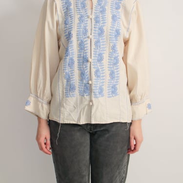 1970s bohemian off-white blouse with baby blue embroidery