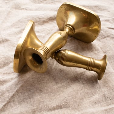 pair of brass candle sticks
