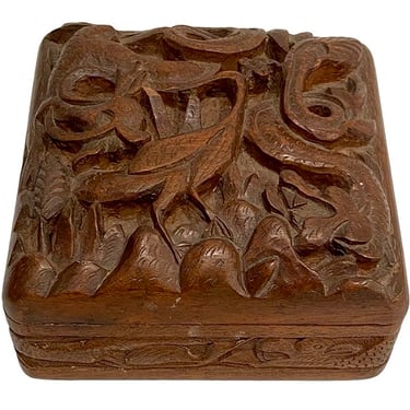Carved wood box with peacock