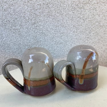 Vintage modern pottery round salt and pepper shakers glaze purple browns signed size 4” x 3” plus handles 