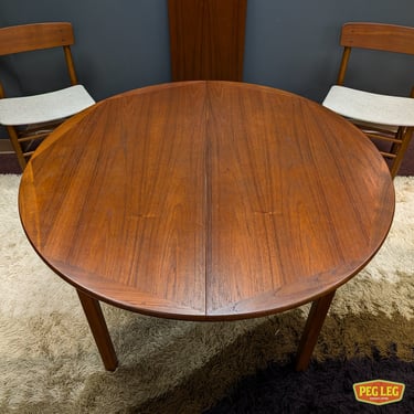 Danish Modern round teak dining table with drop-in extension