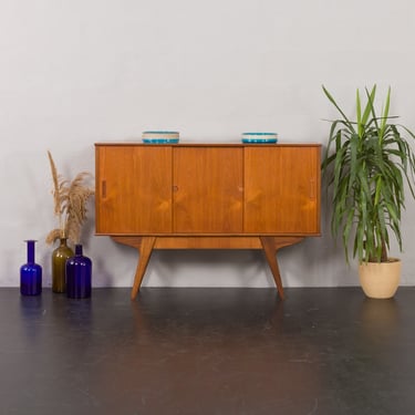 Danish highboard in teak with solid teak base and hidden drawer, Randers, Denmark 1960s. 