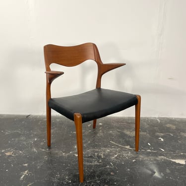 Niels Otto Møller 55 arm chair in teak with new black leather seat