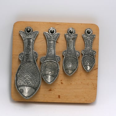 vintage silver metal fish measuring spoons on wood hanger 