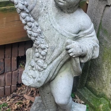 Stone Cherub Pulling Flowers in Right Hand